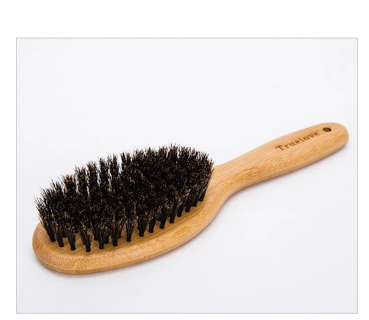 Medium pet deshedding comb with bamboo handle and stainless steel needles in original bamboo colour on a flat surface