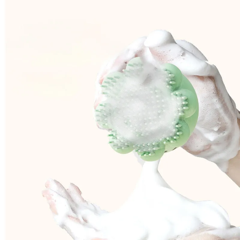 Green pet bath brush with built-in body wash reservoir and soft silicone bristles for dog and cat grooming