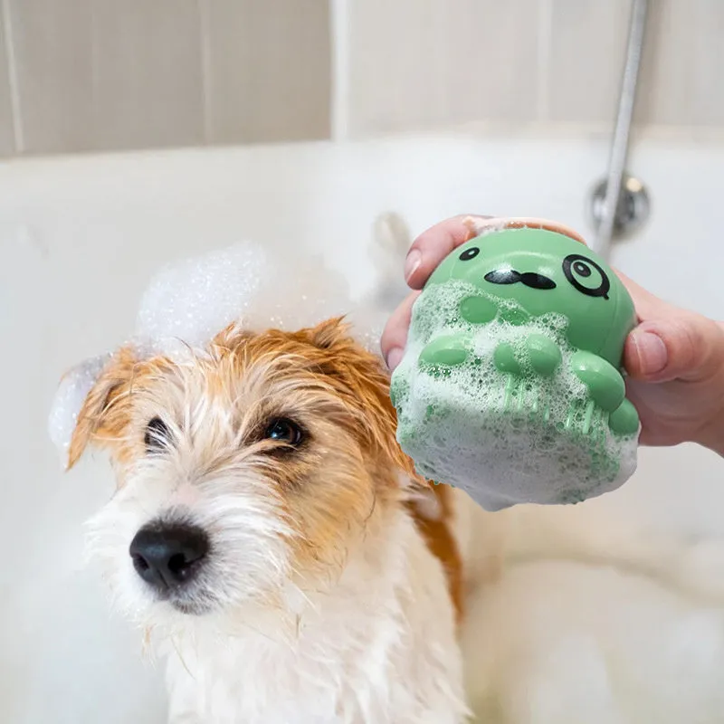 Green pet bath brush with built-in body wash reservoir and soft silicone bristles for dog and cat grooming