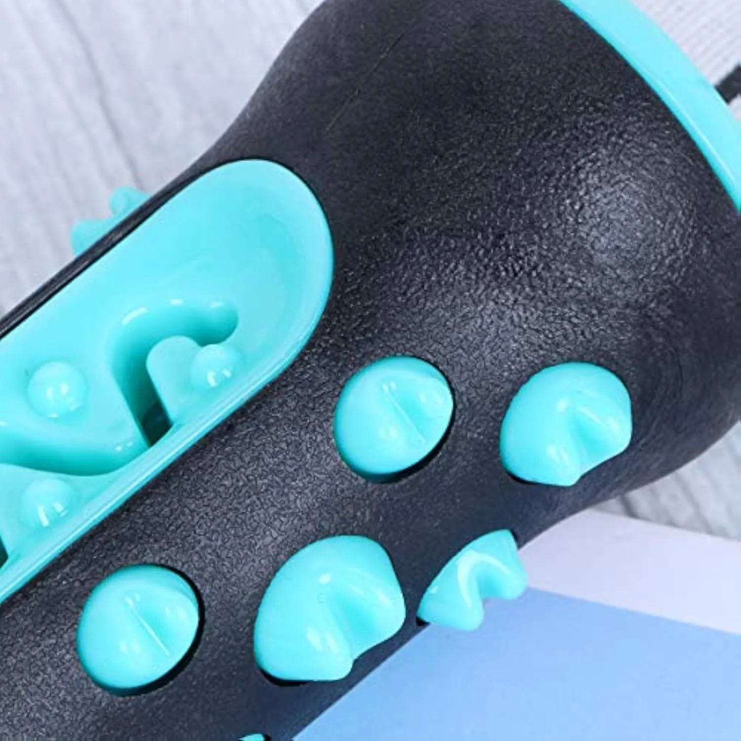 Natural rubber dog dental chew toy in four colours, showing textured surface for teeth cleaning.
