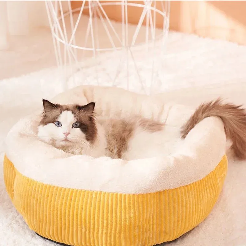 Washable circular cat sofa bed in yellow with plush fabric and non-slip base for calming sleep