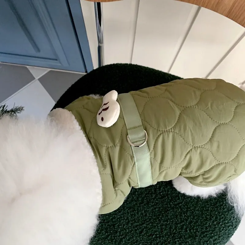 Dog wearing a four-legged cotton-padded winter coat in Small Green Fish pattern