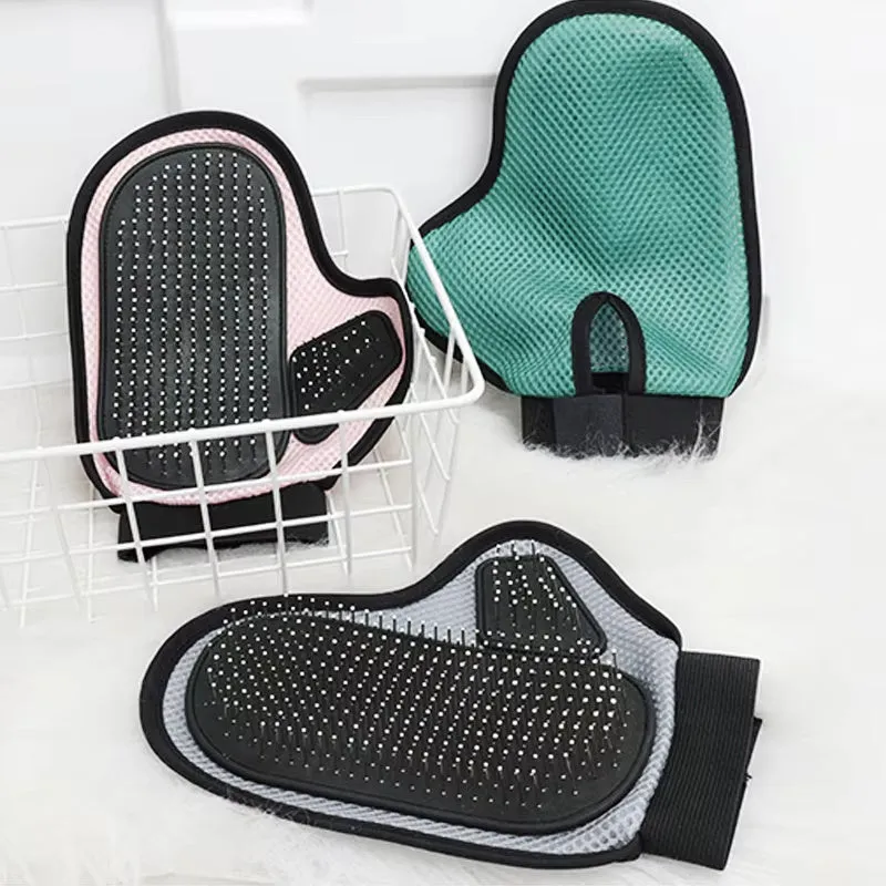 Gray pet grooming glove with silicone massage tips for removing loose cat and dog hair
