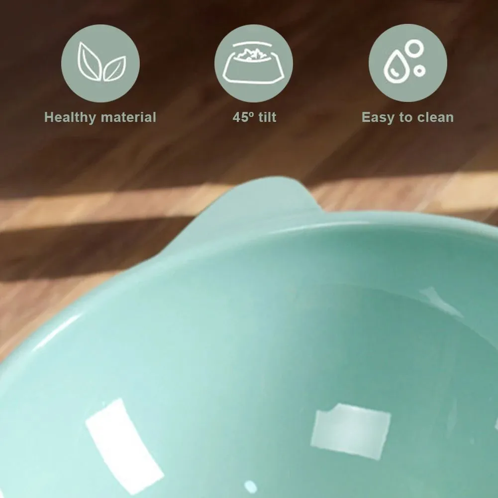 Ergonomic tilted raised plastic cat food bowl in blue with non-slip base for anti vomiting feeding
