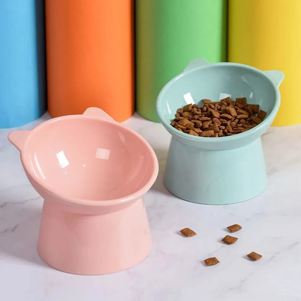 Ergonomic tilted raised plastic cat food bowl in blue with non-slip base for anti vomiting feeding