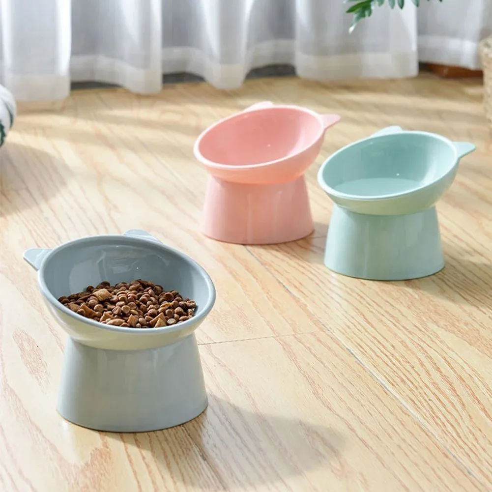 Ergonomic tilted raised plastic cat food bowl in blue with non-slip base for anti vomiting feeding