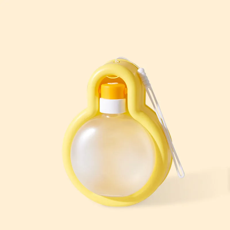 Green portable dog water bottle with integrated drinking bowl for travel and outdoor use