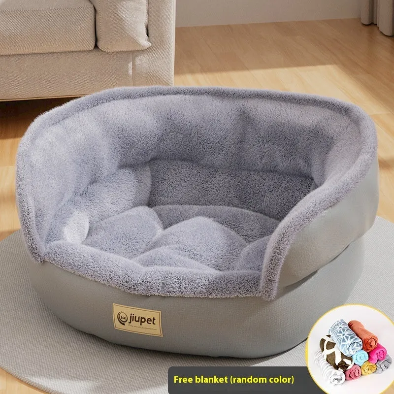 Green cloth sofa-style dog kennel with matching blanket, size M, on a wooden floor
