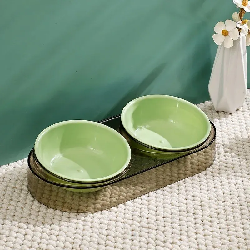 Transparent plastic double cat and dog bowl with two compartments for food and water