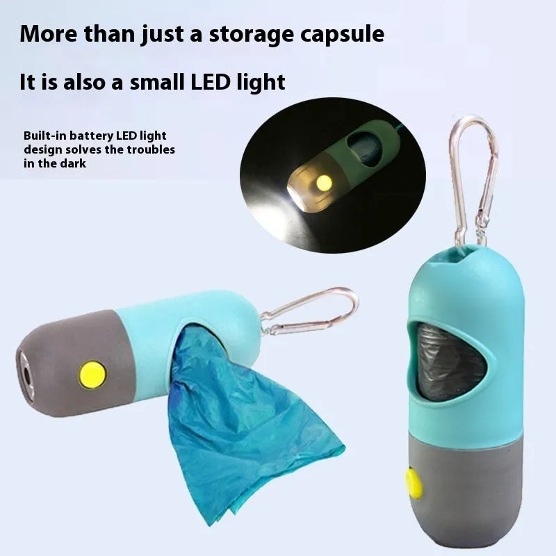 Compact LED pet waste bag dispenser in blue grey with a dog lead attachment and illuminated button