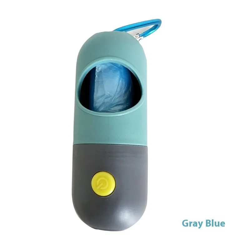 Compact LED pet waste bag dispenser in blue grey with a dog lead attachment and illuminated button