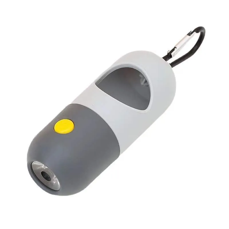 Compact LED pet waste bag dispenser in blue grey with a dog lead attachment and illuminated button