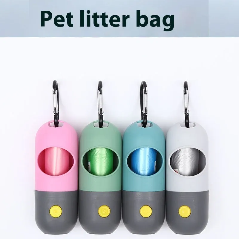 Compact LED pet waste bag dispenser in blue grey with a dog lead attachment and illuminated button