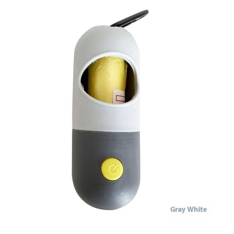 Compact LED pet waste bag dispenser in blue grey with a dog lead attachment and illuminated button