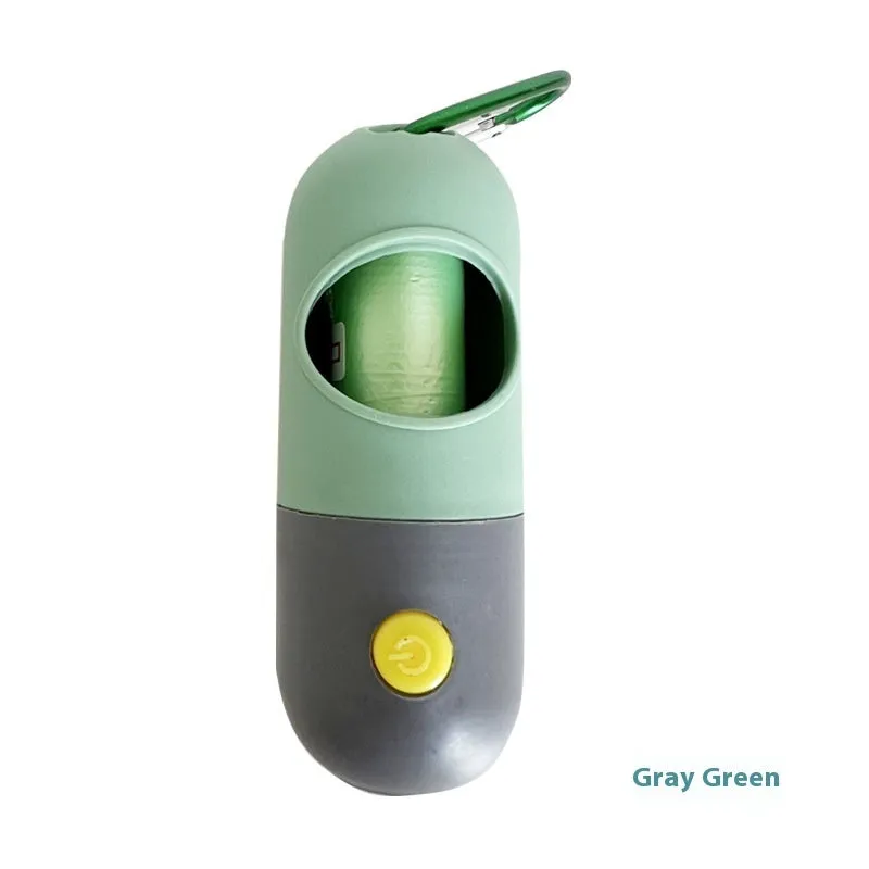 Compact LED pet waste bag dispenser in blue grey with a dog lead attachment and illuminated button