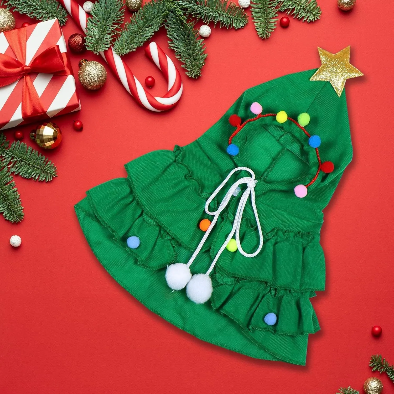 Cat Christmas tree costume in green with star ornament, size M, on a cat