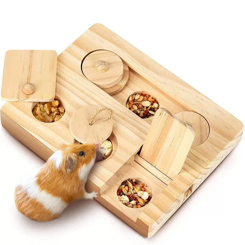 Wooden hamster feeder in natural wood colour on a flat surface