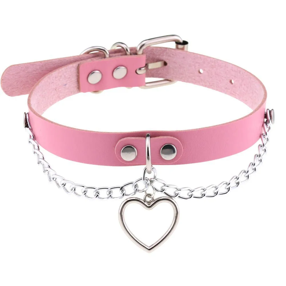 Heart-shaped leather collar clavicle necklace in black with chain link detail on woman's neck