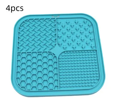 Green silicone pet licking pad 20x20cm with suction cup base on a tiled floor