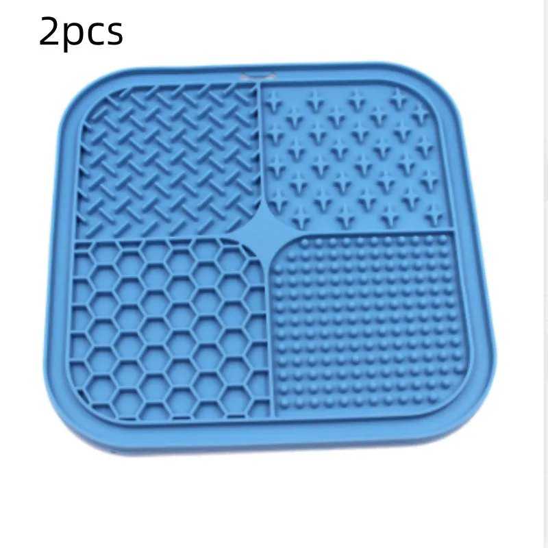 Green silicone pet licking pad 20x20cm with suction cup base on a tiled floor