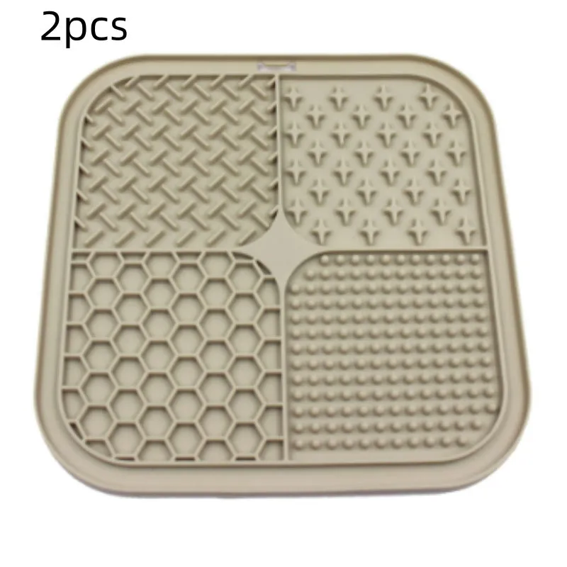 Green silicone pet licking pad 20x20cm with suction cup base on a tiled floor