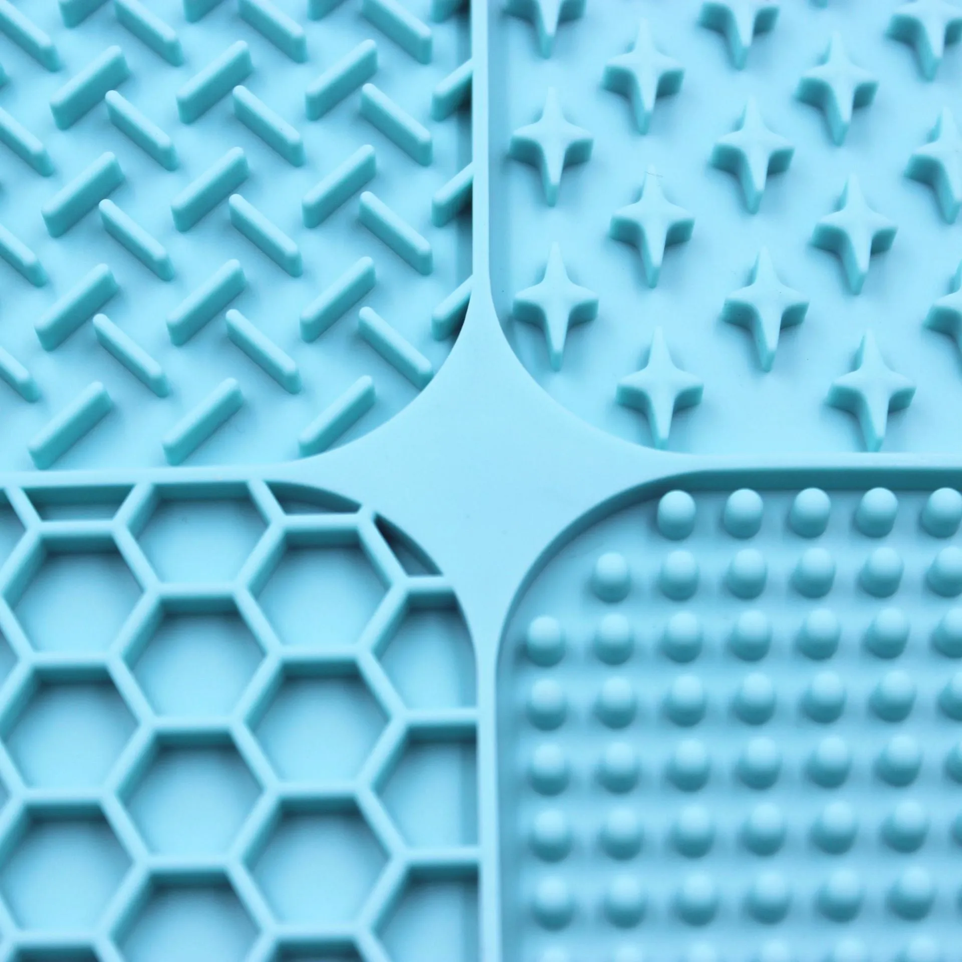 Green silicone pet licking pad 20x20cm with suction cup base on a tiled floor