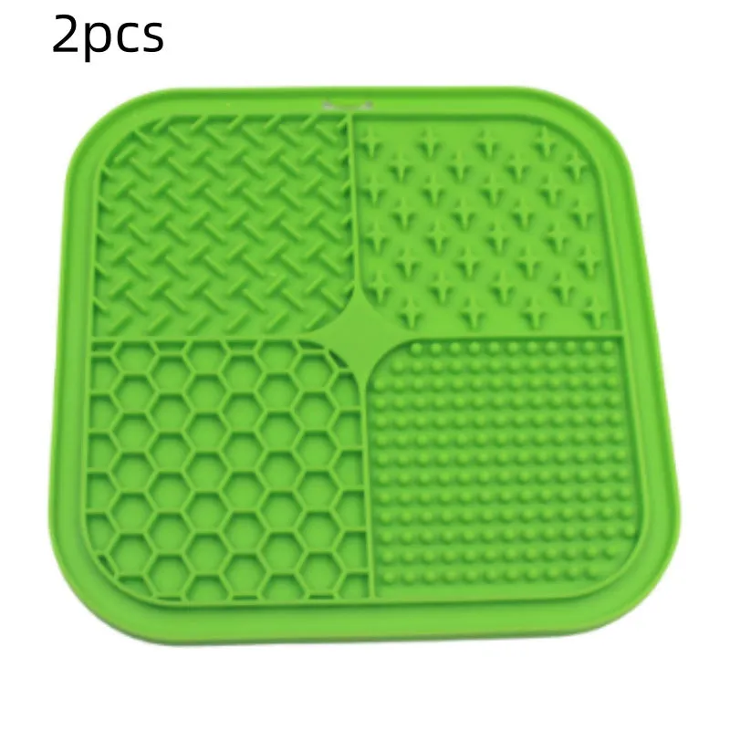 Green silicone pet licking pad 20x20cm with suction cup base on a tiled floor
