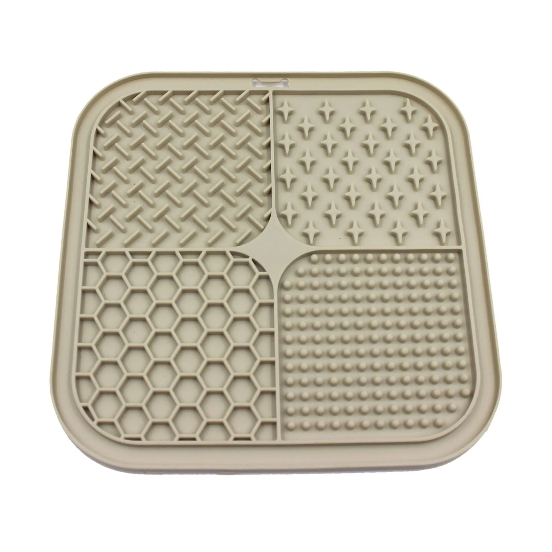 Green silicone pet licking pad 20x20cm with suction cup base on a tiled floor