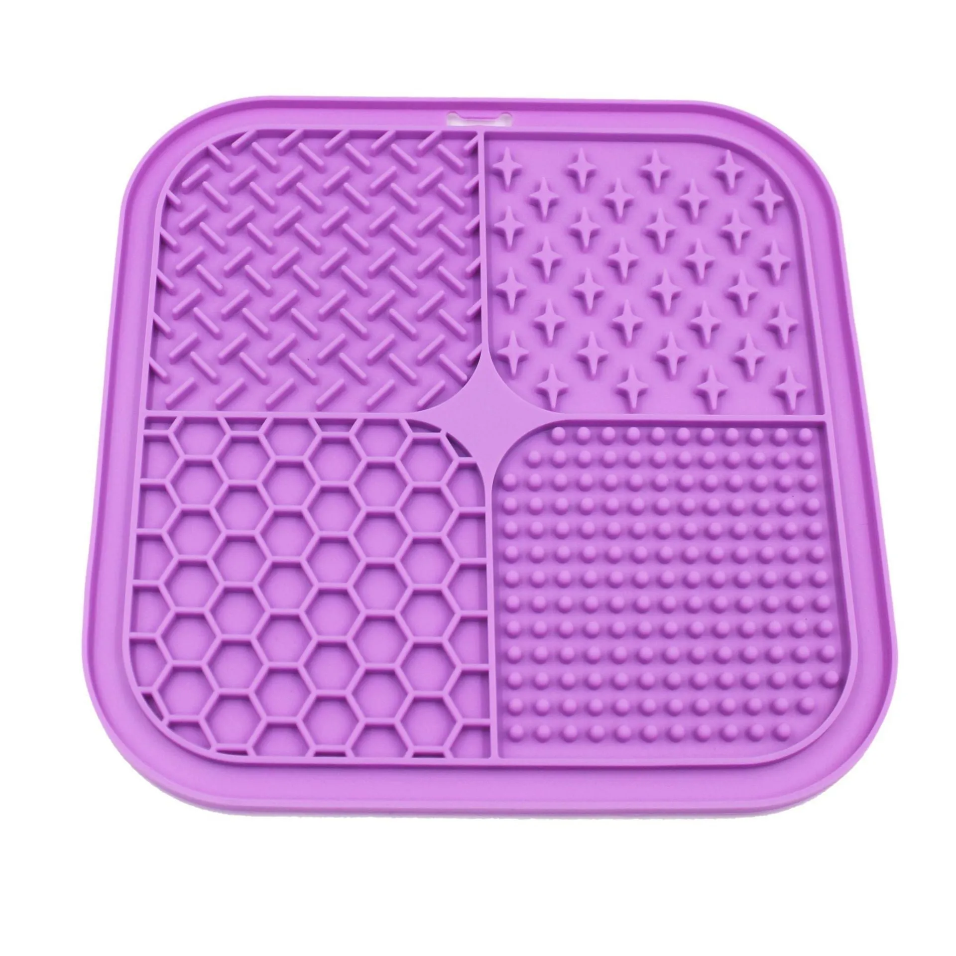 Green silicone pet licking pad 20x20cm with suction cup base on a tiled floor