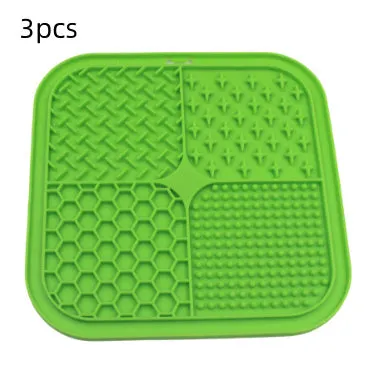 Green silicone pet licking pad 20x20cm with suction cup base on a tiled floor