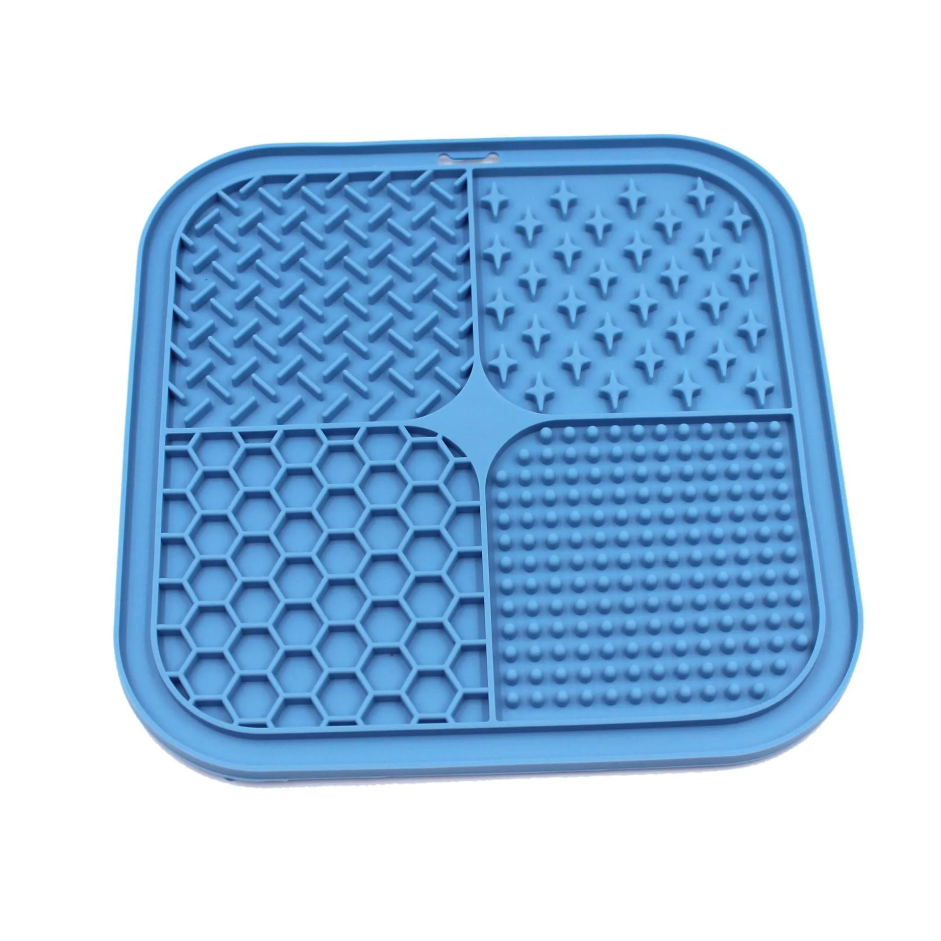 Green silicone pet licking pad 20x20cm with suction cup base on a tiled floor
