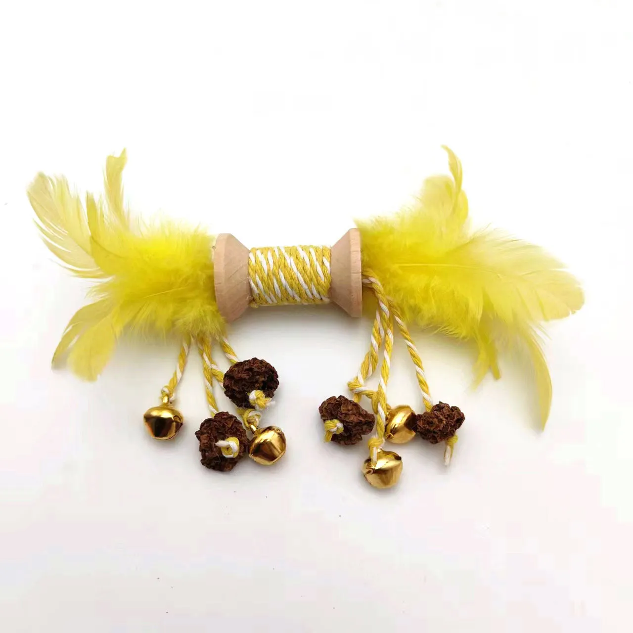 Feather bell gall fruit cat toy in ginger colour with bells and feathers on green background