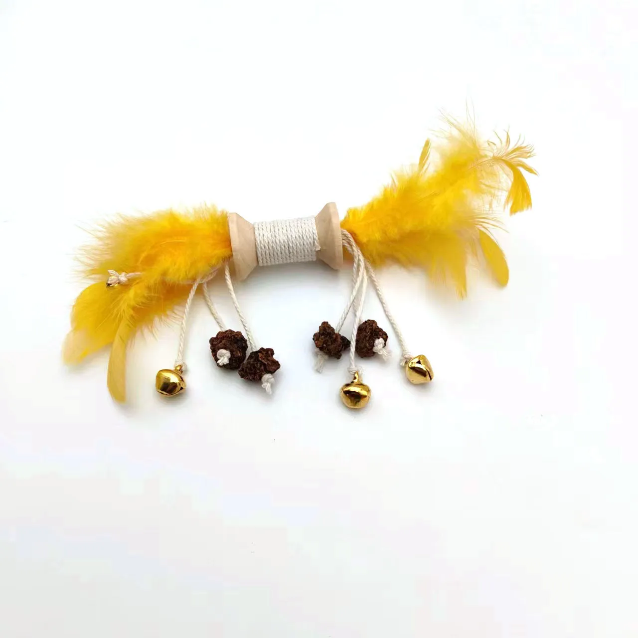 Feather bell gall fruit cat toy in ginger colour with bells and feathers on green background
