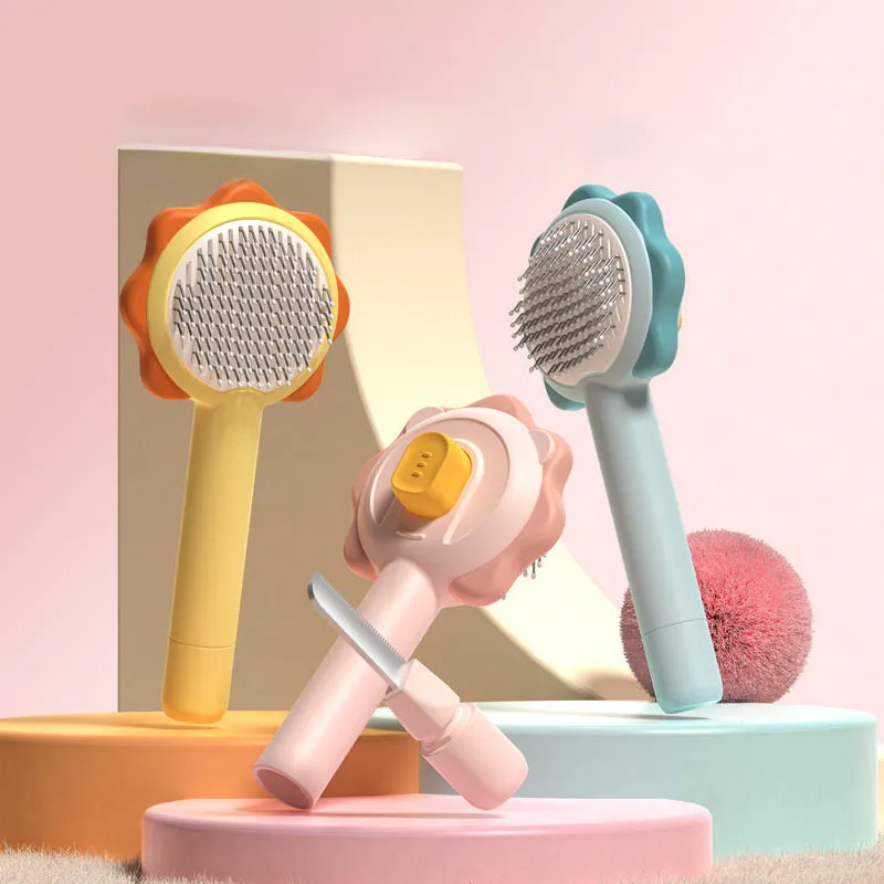 Stainless steel pet comb with one-click hair removal in blue, pink, and yellow colours on white background