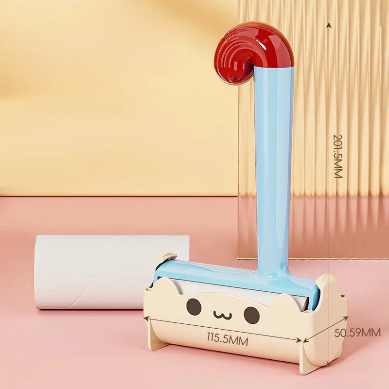 Blue cat sticky hair device with replaceable sticky paper roller on a fabric surface