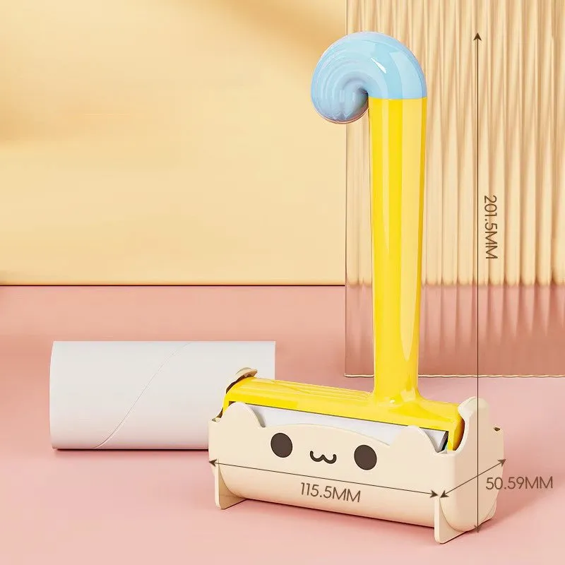 Blue cat sticky hair device with replaceable sticky paper roller on a fabric surface