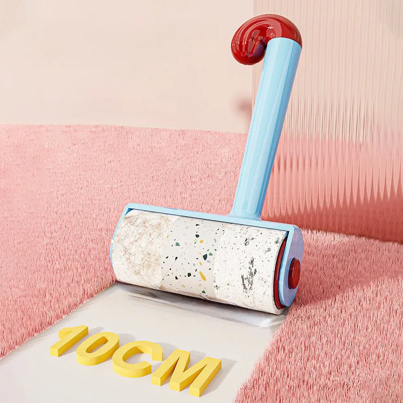 Blue cat sticky hair device with replaceable sticky paper roller on a fabric surface