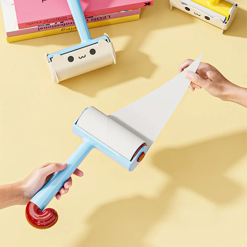 Blue cat sticky hair device with replaceable sticky paper roller on a fabric surface