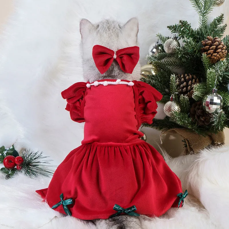 Pet Christmas dress in red silver fox velvet with matching headdress flower on a small dog