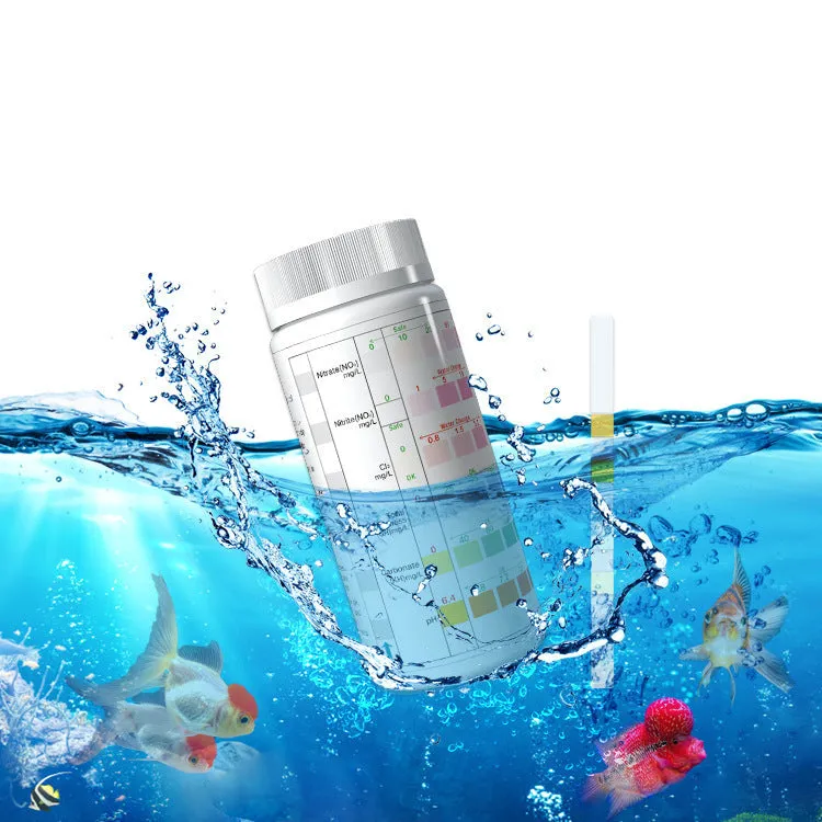 Six-in-one aquarium water quality test paper on a white surface, showing colour pads for total hardness, nitrate, nitrite, chlorine, carbonates, and pH testing
