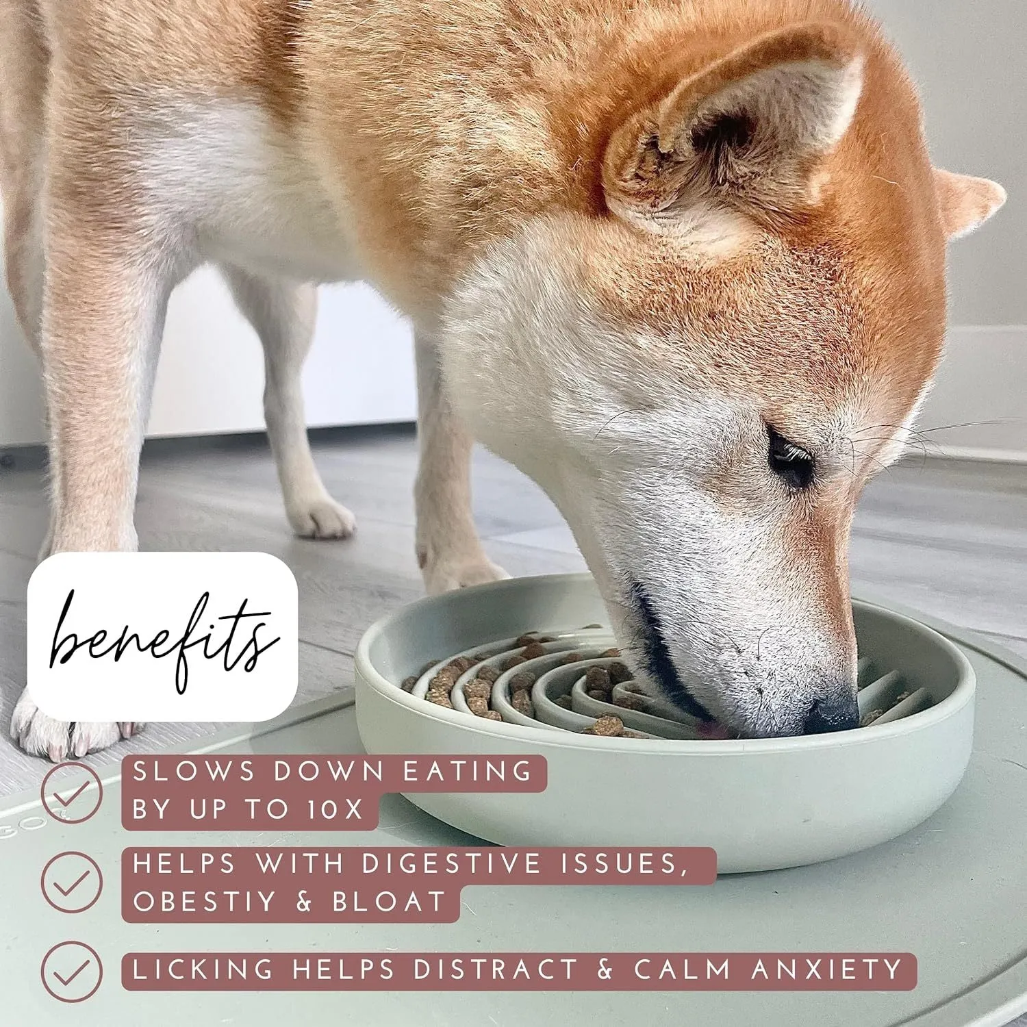 Silicone slow feeder dog bowl with ridges in various colours on a table.