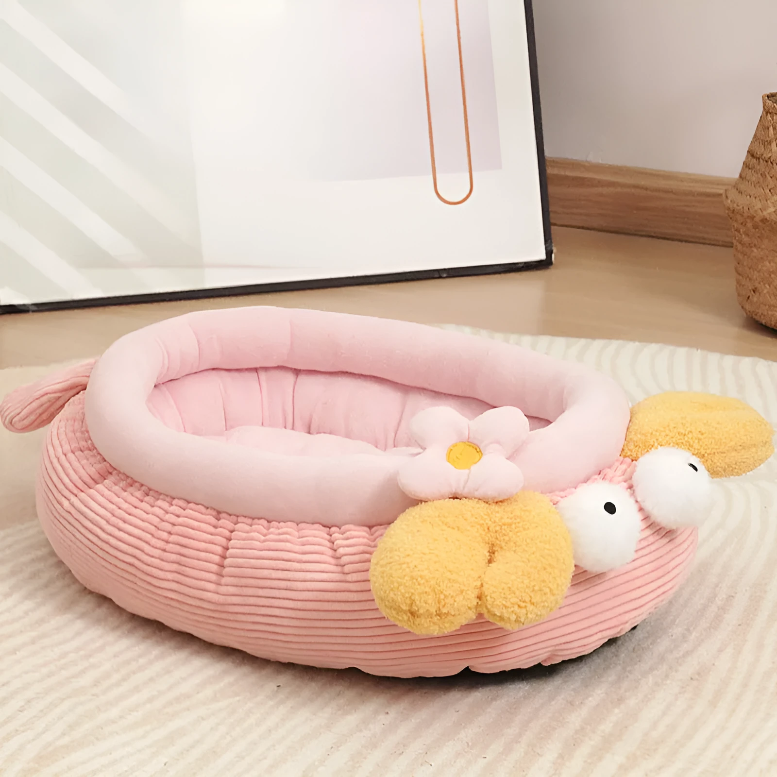 Pink semi-enclosed lobster pet nest with teddy fleece interior and non-slip base on a wood floor
