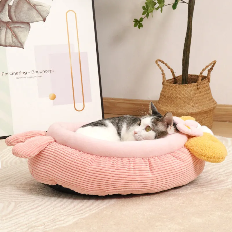 Pink semi-enclosed lobster pet nest with teddy fleece interior and non-slip base on a wood floor