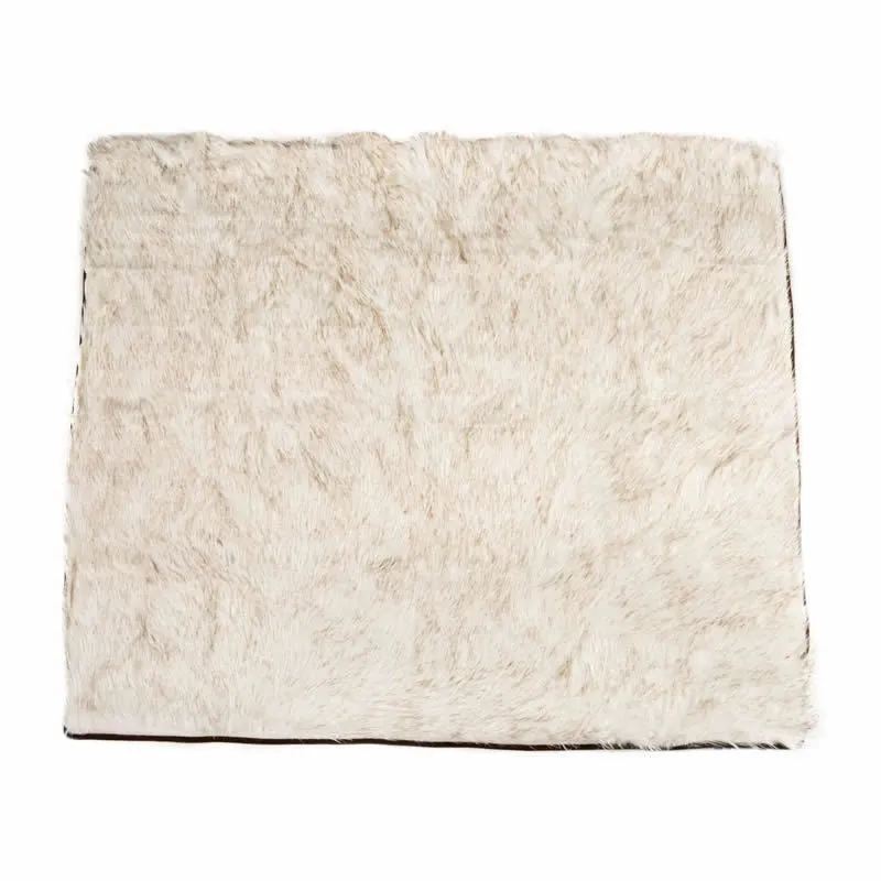 White with brown accents machine washable waterproof dog couch bed on a floor