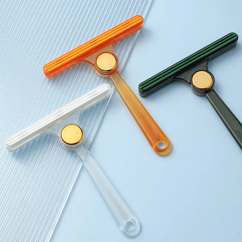 Manual fabric shaver with AS and TPE soft rubber body in transparent, green and yellow colours on white background