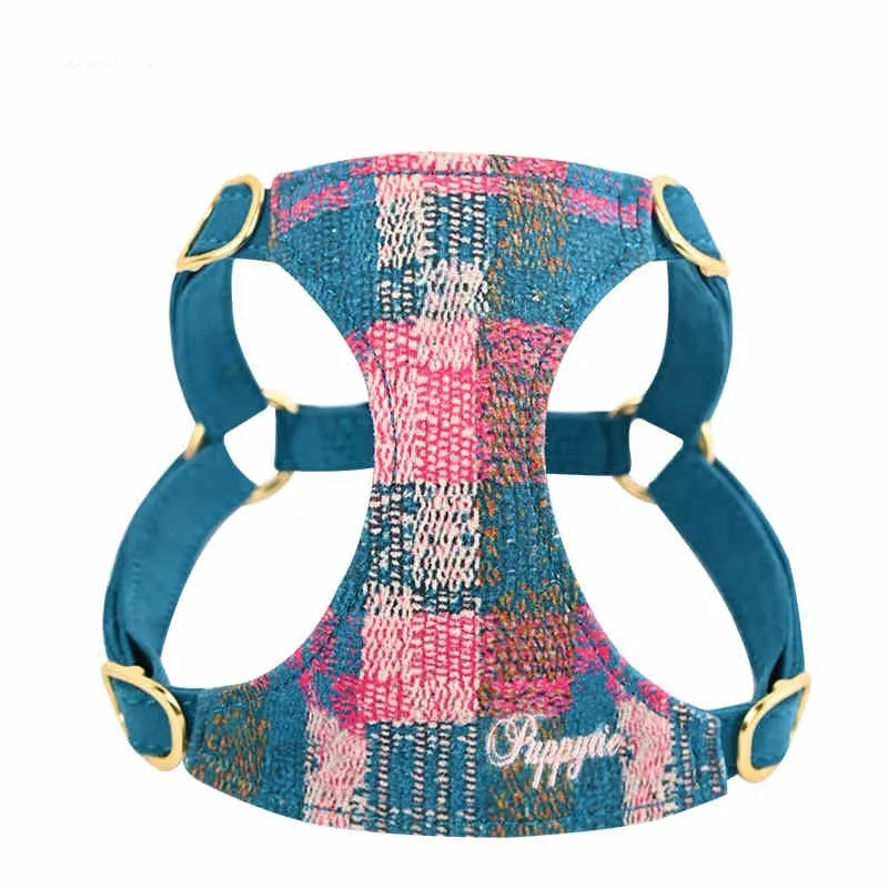 Dog hand holding rope vest walking harness in Dark Night Blue with traction rope on a small dog