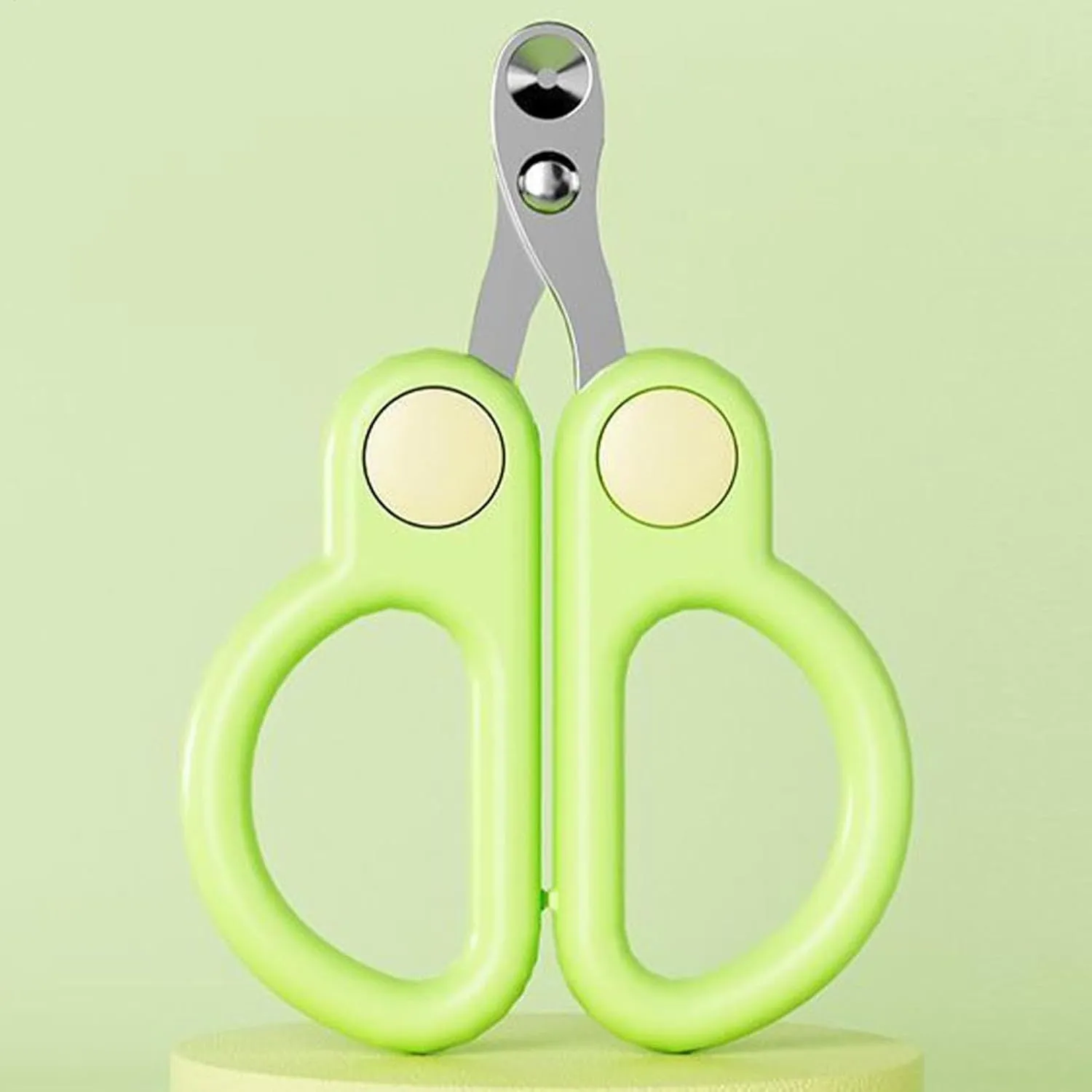 Pet nail clippers with round hole design, stainless steel blades, and ergonomic handles. Available in green or yellow.