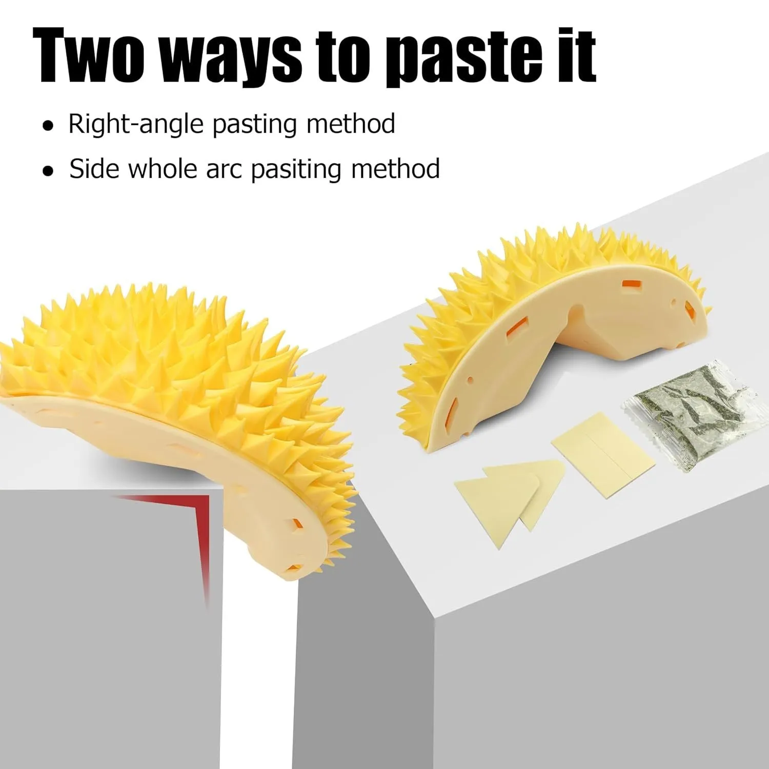 Yellow durian-shaped cat corner scratcher with grooming comb attached to a wall.