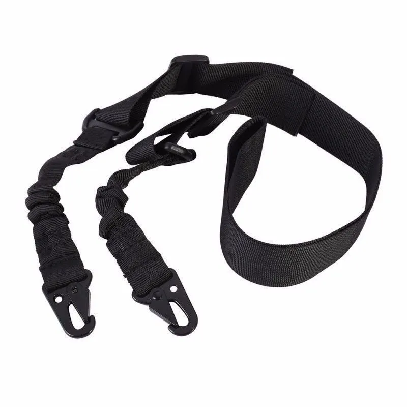 Black crossbody nylon survival tool placement rope with metal buckle and elastic tension adjustment on plain background