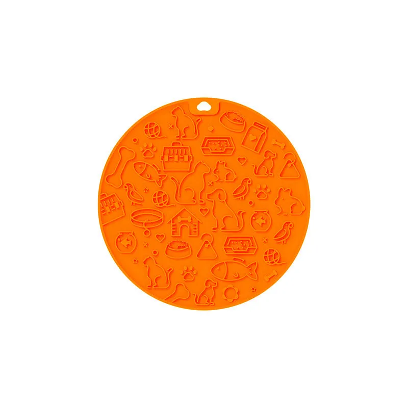 Round blue silicone pet licking mat with sucker base on a floor.
